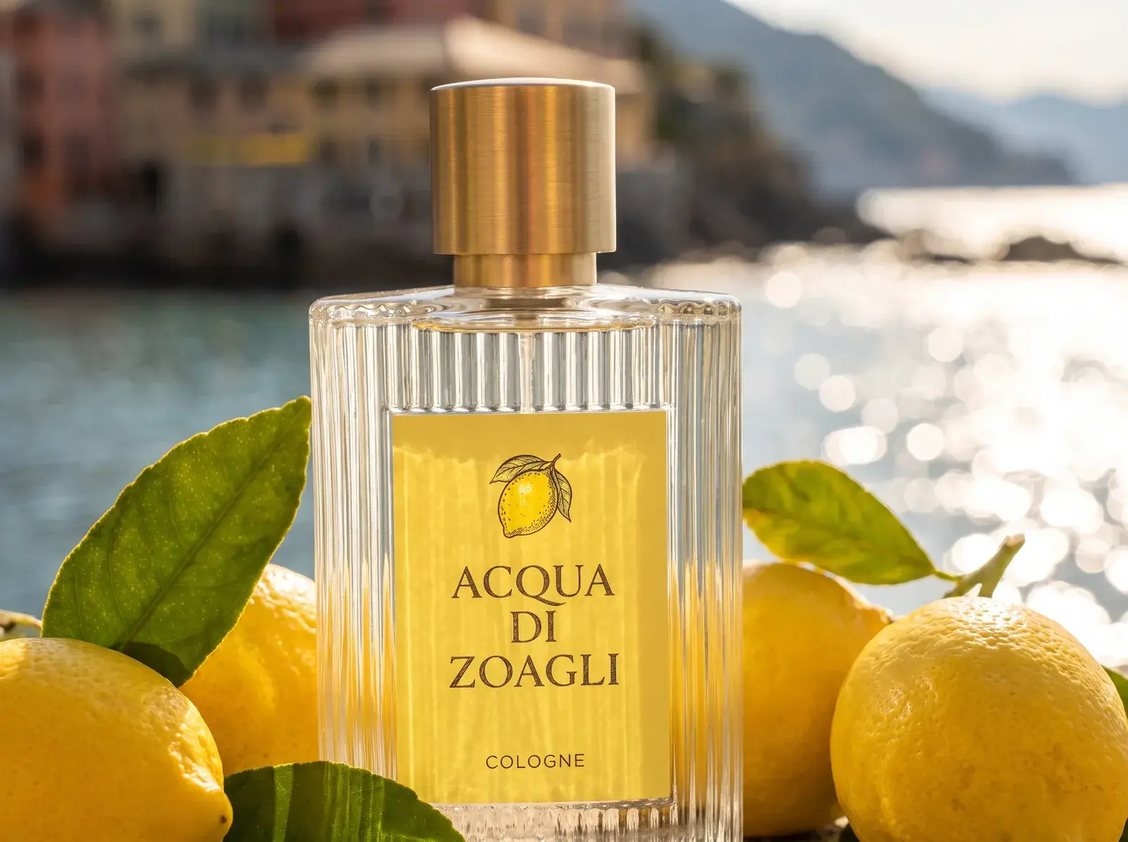 The Acqua di Zoagli bottle upright among lemons, the sea sparkling behind